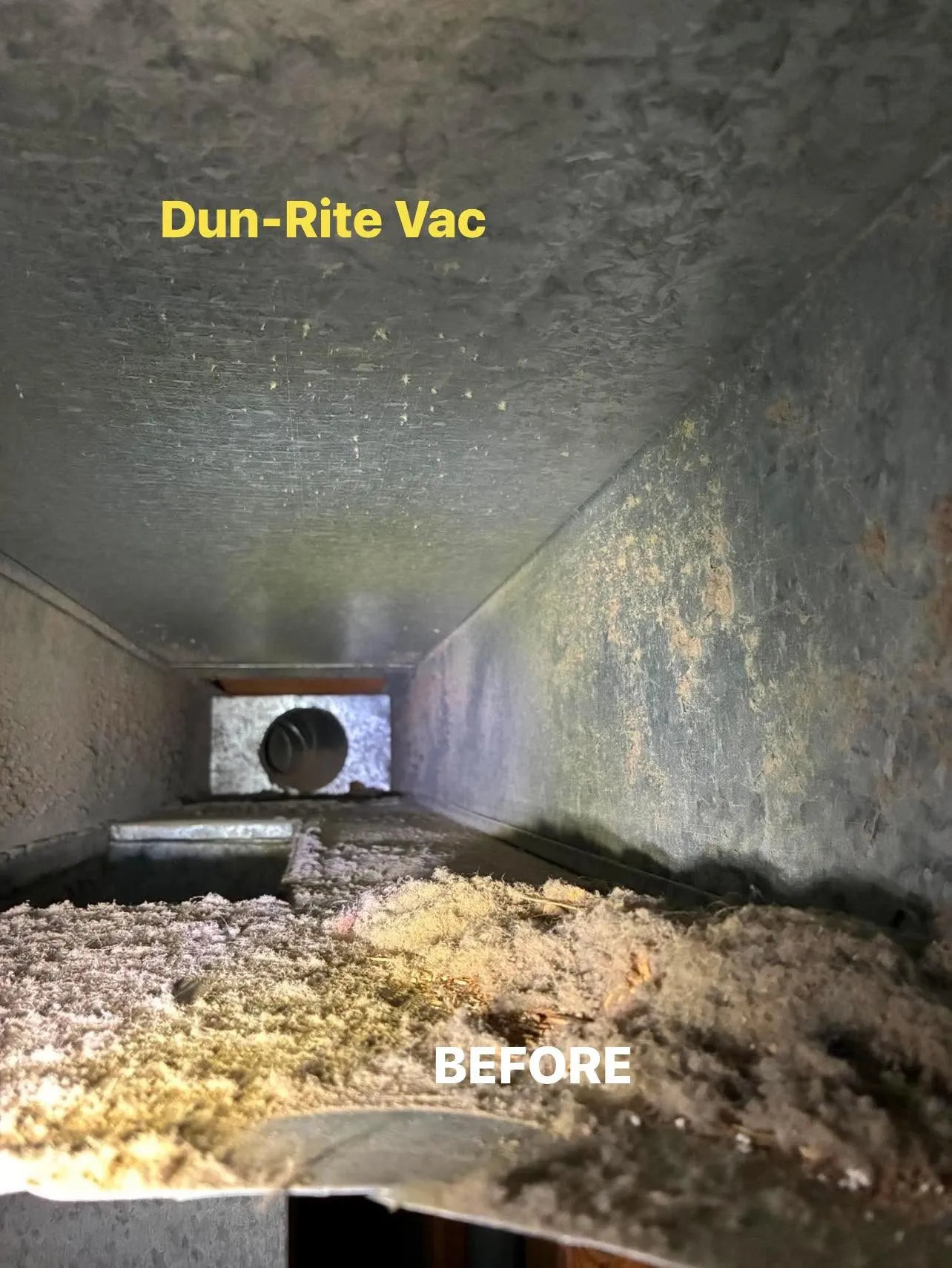 Lint buildup inside a residential dryer vent before professional cleaning