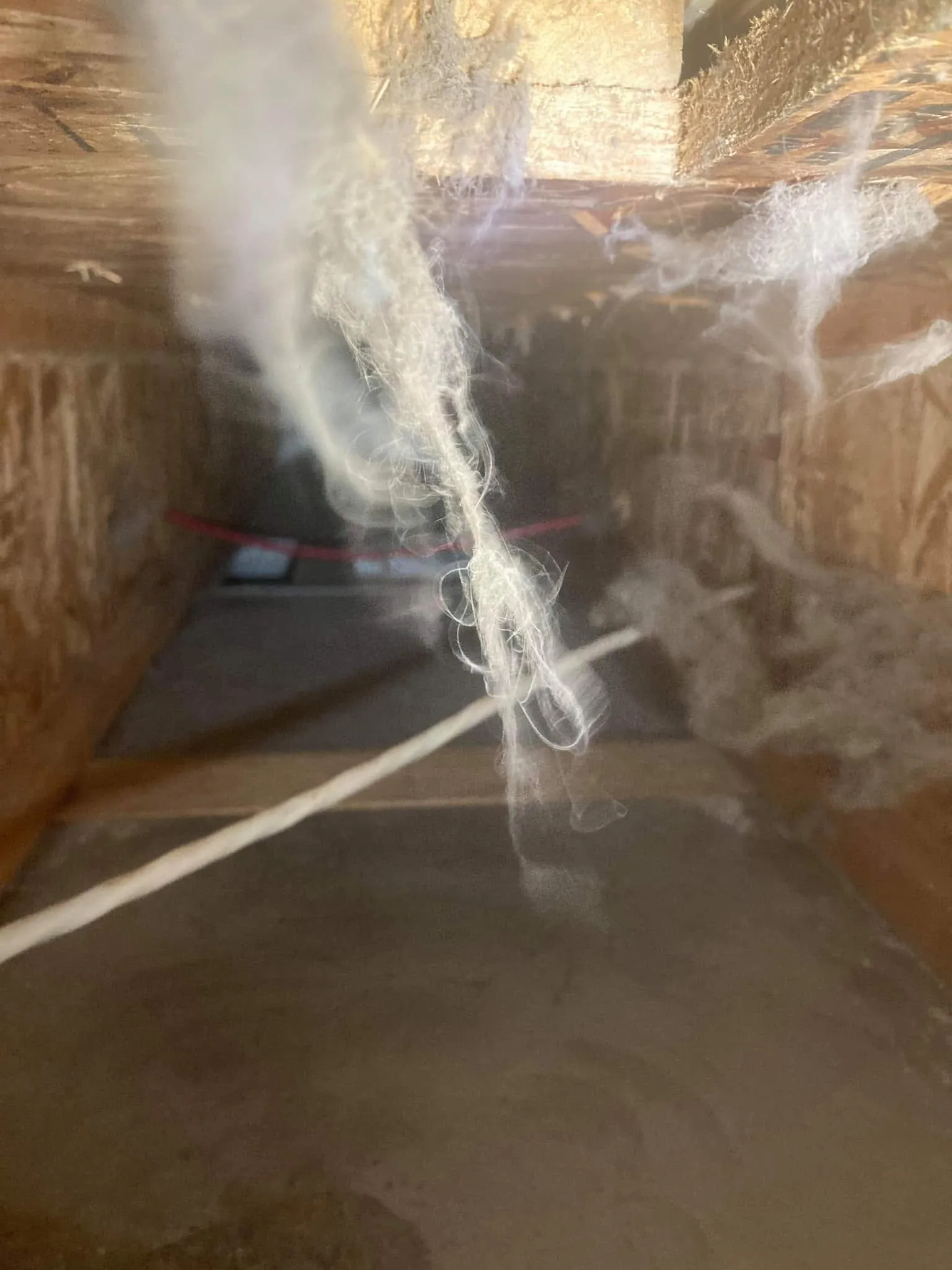 Dust and debris buildup inside HVAC ductwork after a home renovation